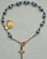 Gold over Sterling Silver Swarovski Crystal Rosary Bracelet with blue swarovski crystal cap beads.